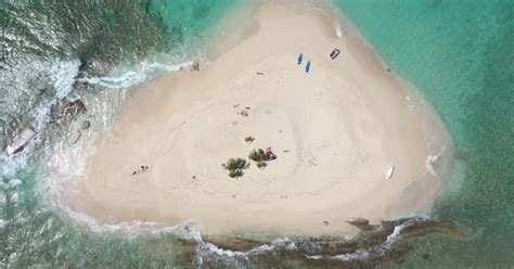 Aerial: Sandy Spit - British Virgin Islands - bird's eye view of the ...