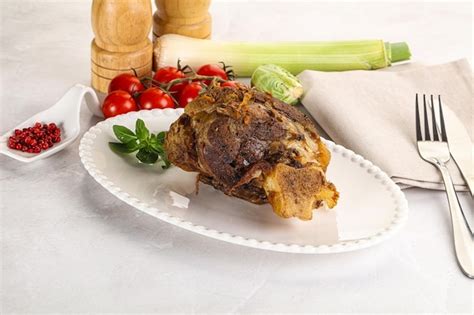 Premium Photo | Baked lamb shank with bone marinated in spices