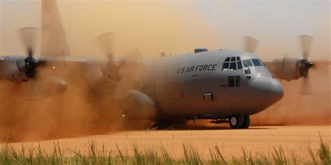 File:C-130 Hercules performs a tactical landing on a dirt strip.jpg ...