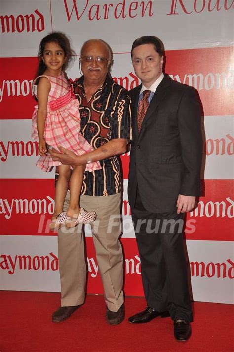 Gautam Singhania with his dad and daughter at Raymonds new store at Warden Road. . Media