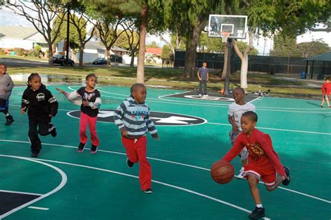 Photos: Kids Enjoying Brandon Jennings' Refurbished Rowley Park Basketball Court | Sole Collector