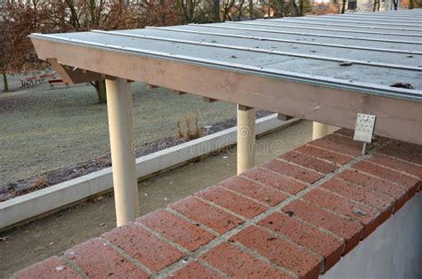 Wooden Structure of the Pergola Supported by Smooth Cylindrical White ...