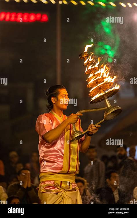 Ganga aarti, Portrait of an young priest performing river ganges ...