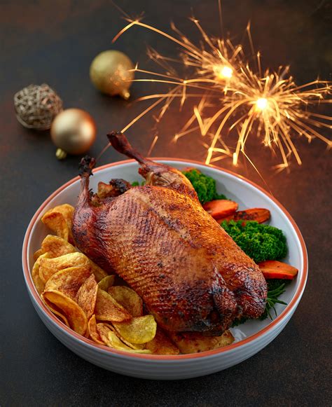 Freshly roasted duck roast with christmas lights on Behance