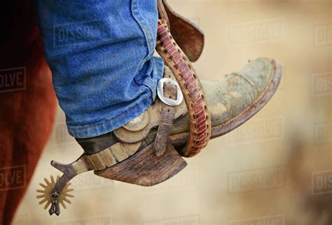 Cowboy boot with spur - Stock Photo - Dissolve