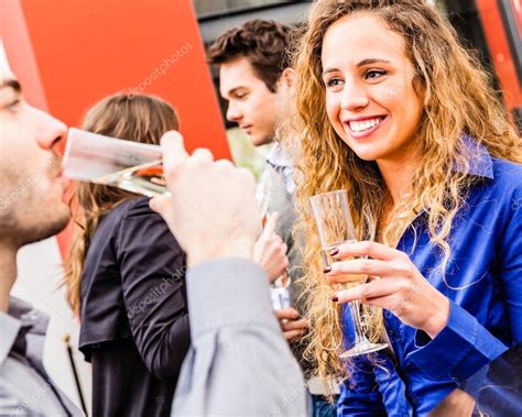 Young people drinking wine in restaurant — Stock Photo © GiorgioMagini #122926670