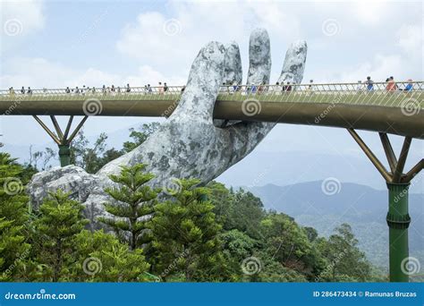 Golden Bridge with a Hand Sculpture Stock Photo - Image of asia, yellow: 286473434