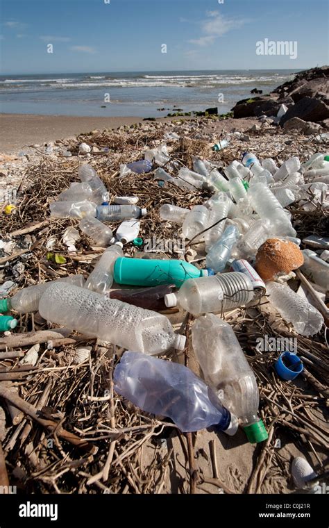 Plastic bottles litter the beach on an isolated part of South Padre Island on the Gulf of Mexico ...