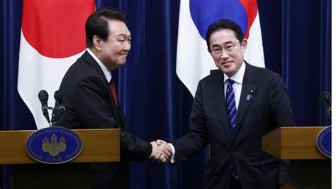 South Korea and Japan: A milestone meeting of frenemies - BBC News