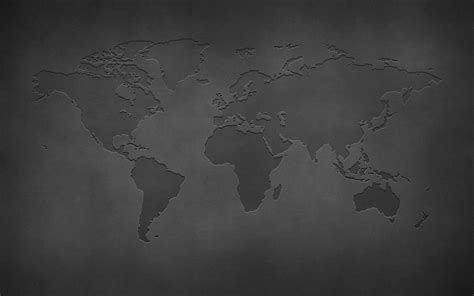 a black and white photo of the world map on a dark background with space for text