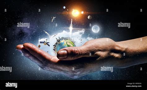 Planet earth in hands. Elements of this image are furnished by NASA ...