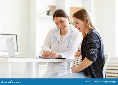 Pregnant Woman at Checkup stock image. Image of checkup - 145611183