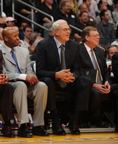 Phil Jackson and coaching staff finds a play amusing.JPG