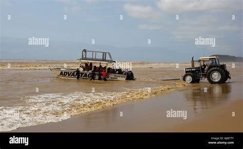 launching of boat on st lucia beach Stock Photo - Alamy