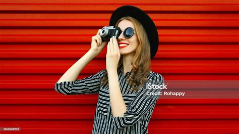 Portrait Young Woman Photographer With Vintage Film Camera Over Red Wall Background Stock Photo ...