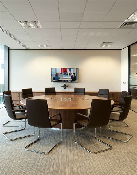 Board Room >> Circular Meeting Room Table >> This round wooden table in the boardroom at Ame ...