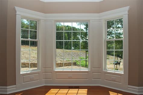 Integrate Window And Door Trim With Wainscoting Panels | Interior window trim, Moldings and trim ...