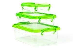 Plastic containers filled with cereals, concept of organization of storage of bulk cereals on ...