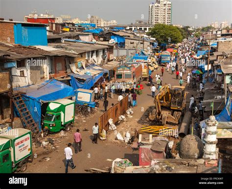 A view from above of a slum in Mumbai in India. People can be seen ...