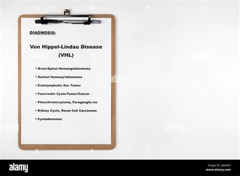 Von Hippel-Lindau Disease diagnosis with symptoms list on clipboard ...