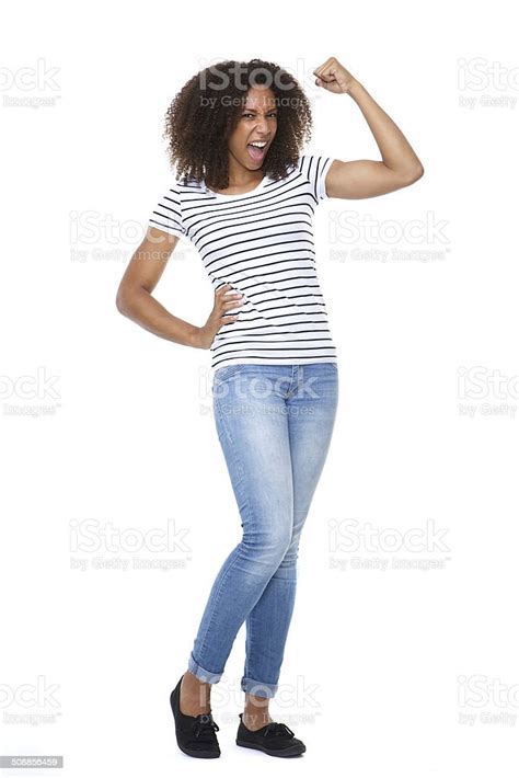 Young Woman Flexing Arm Muscle Stock Photo - Download Image Now - Women ...