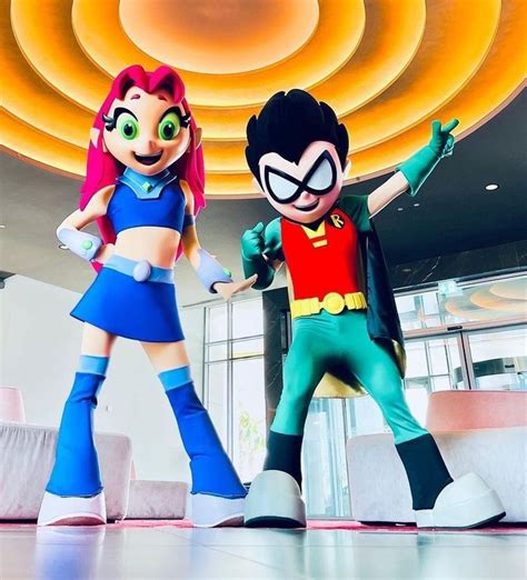 two cartoon characters standing in front of a ceiling