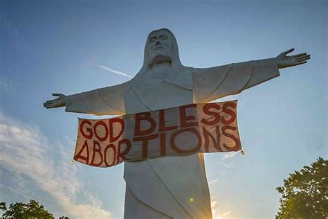 Activist group hangs "God Bless Abortion" banner on Christ of the Ozarks statue | Not the Bee