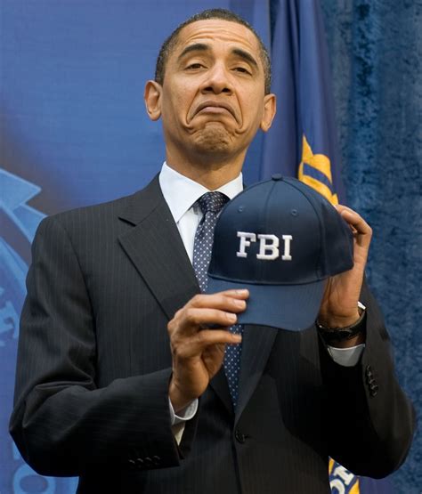 Showing off his FBI hat in 2009. | Underrated Photos of Obama as President | POPSUGAR News Photo 11