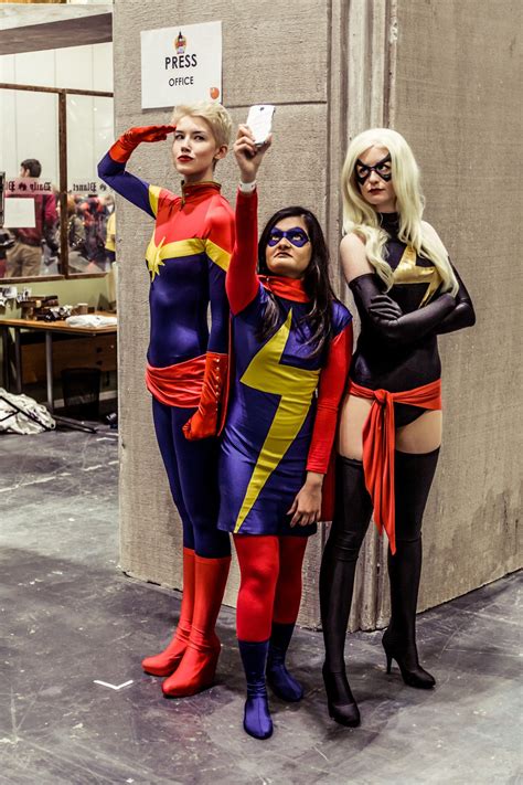 two women dressed in costumes posing for a photo