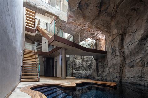 Modern Cave Villa Built into a Massive Rock with Underground Grotto