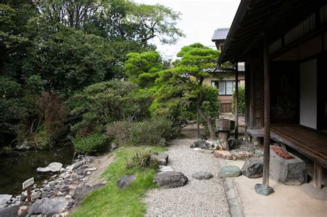 Premium Photo | Views of an old japanese style house with its garden and a small lake in ...