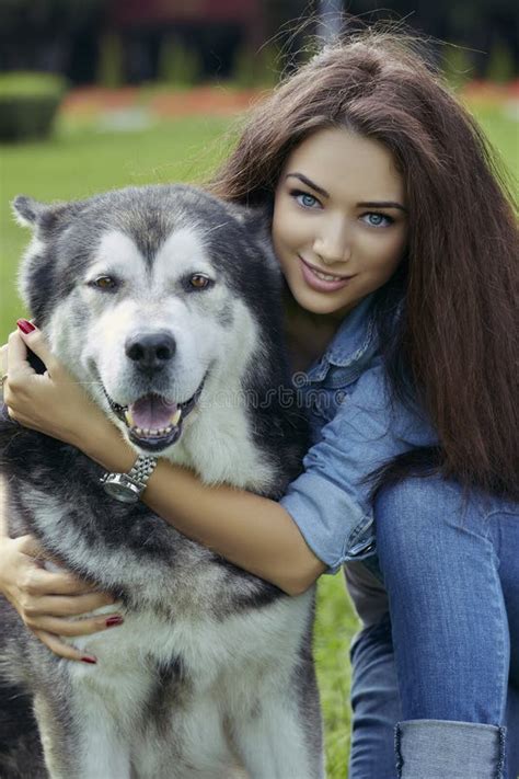 Beautiful Woman With Malamute Dog Stock Photo - Image: 44407940