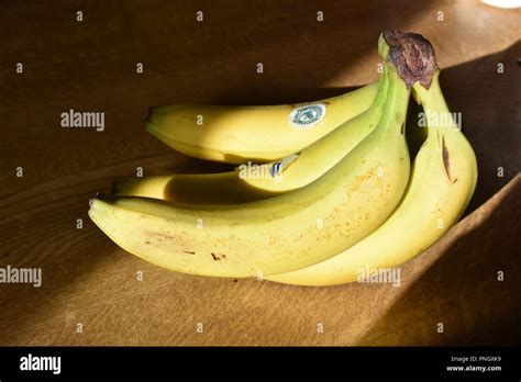 Bananas in sunlight Stock Photo - Alamy