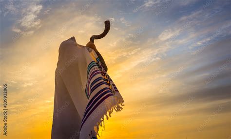 Blowing the Shofar - man in a tallith, Jewish prayer shawl is blowing ...