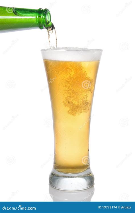 Beer Pouring From Bottle Into Glass Stock Images - Image: 13773174