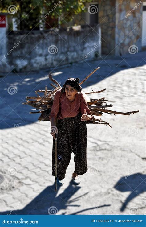 A Very Old Lady Carrying Sticks on Her Back Editorial Stock Photo ...