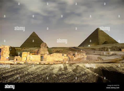 Giza pyramids and Sphinx light up at night Stock Photo - Alamy