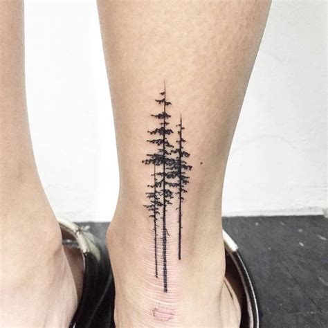 Pine tree tattoo an ankle Three black pine trees inked on the back of the ankle | Small tattoos ...