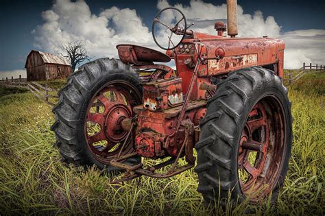 Abandoned Old Farmall Tractor in a Grassy Field Photograph by Randall Nyhof - Pixels