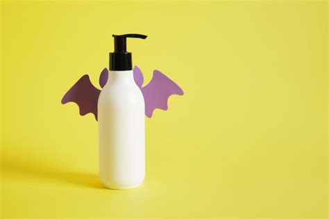 Premium Photo | Mocap oil or cream bottle with bat wings