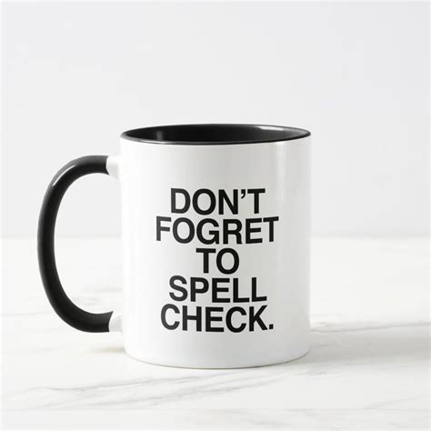 a black and white coffee mug with the words don't forget to spell check