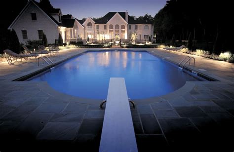 The landscape and pool area lighting make this mesmerizing. | Outdoor lighting design, Pool ...