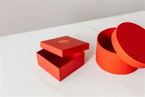 Different shapes red gift boxes on table · Free Stock Photo