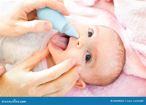 Cleaning baby nose stock image. Image of head, innocence - 64448633