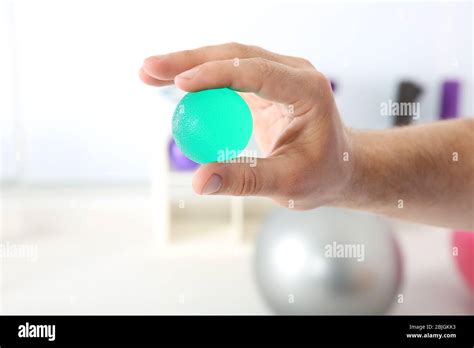 Male hand with stress ball in clinic Stock Photo - Alamy