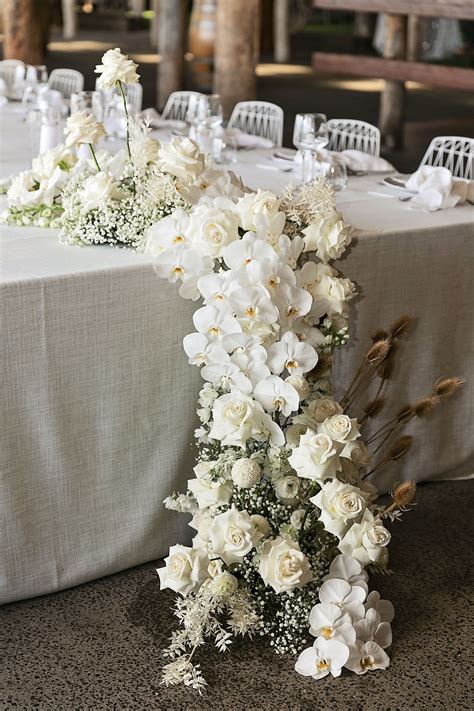 Modern White Wedding Style with Babies Breath, Phalaenopsis Orchids, Roses and Dried Flowerin ...