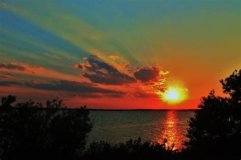 Sun Rays And Sunset At Wilson Lake, Kansas. Photograph by Greg Rud