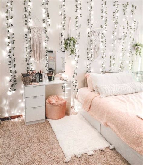 a bedroom with lights strung up on the wall, and a bed in the middle