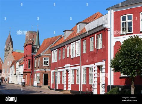 Street with red historic houses in the medieval town Ribe, Denmark ...