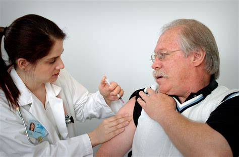 Free picture: middle, aged, man, receiving, intramuscular, immunization, shoulder, muscle ...